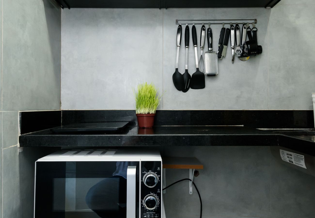 Compact kitchen with common utensils.