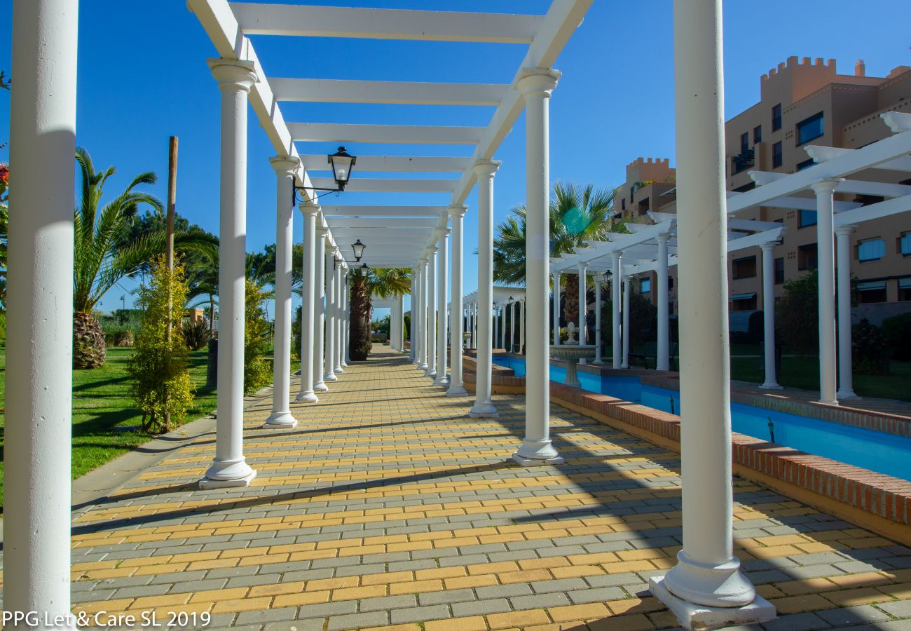 Appartement à Isla Canela - Appartement avec piscine à 10 m de la plage